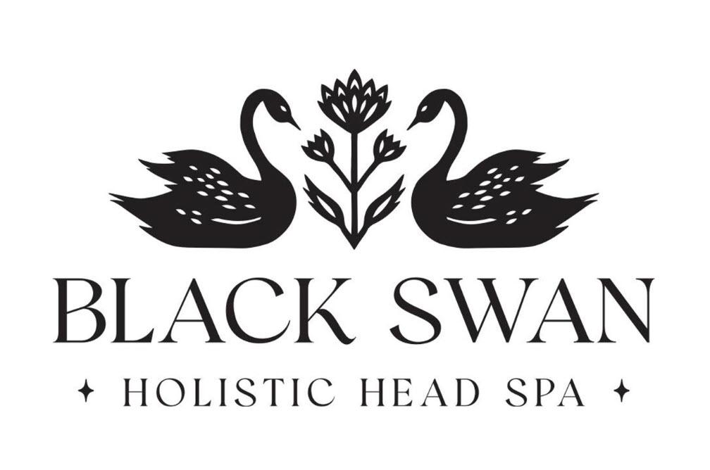 Clean, professional medical spa treatment room with neutral tones at Black Swan Holistic Head Spa in Indianapolis